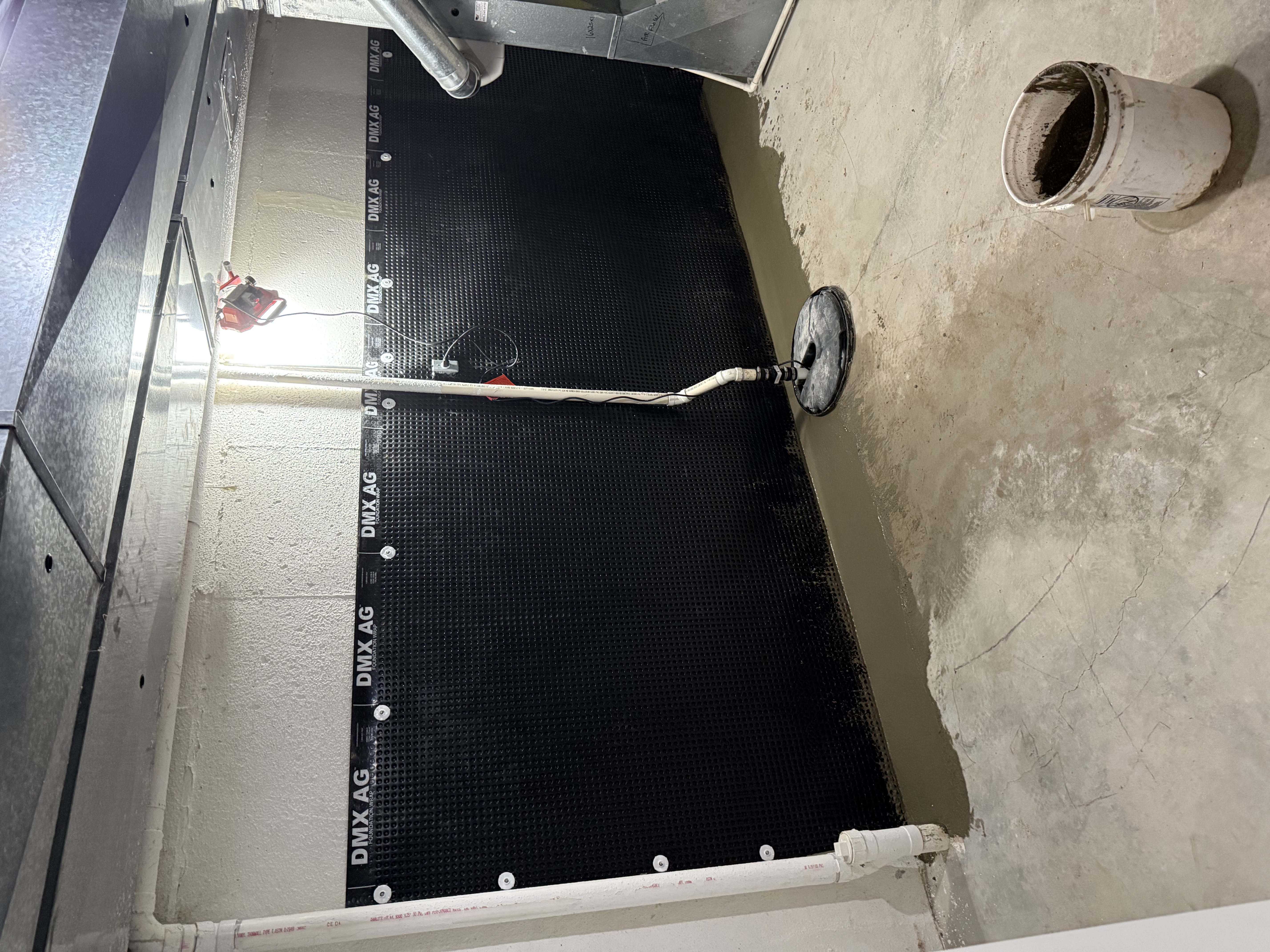 Interior waterproofing drainage system installation